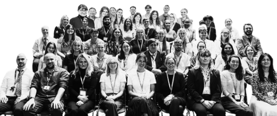 Black and white group photo of trainee teachers and staff
